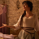 Camila Cabello strikes a pose in a dressmaking scene in the new musical Cinderella.